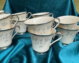 Lenox Windsong china coffee cups with saucers. RETIRED This Windsong pattern was manufactured for 28 years by the Lenox China Company, based in the USA . The warm, translucent ivory background and the soft, light blue and white floral arrangement are typical Lenox floral genius. Finished with a heavy platinum trim to provide strength on the outside. 