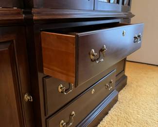 Ethan Allen Georgian Court two piece lighted china cabinet. Has size storage and three drawers, including a silver insert.