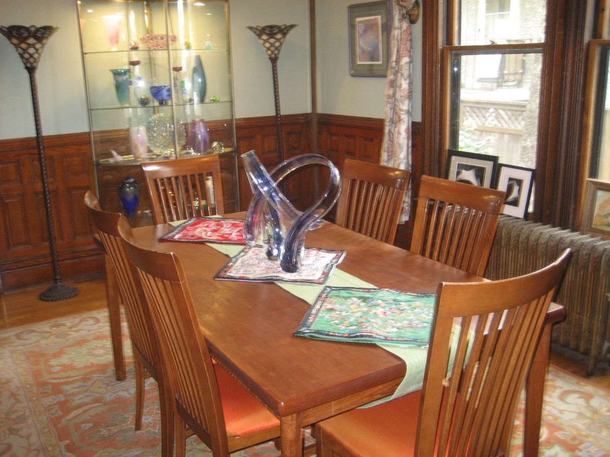 Teak dining table and 6 chairs, area rug, torchiere lamps, all glass display cabinet