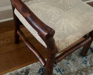 Upholstered in "pine branch" pattern!