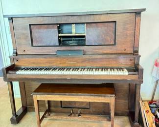 Piano player with player rolls. 
