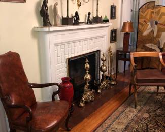 The antique brass andirons are a large 32" tall