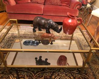 Metal, glass top and mirrored bottom coffee table, leather rhinoceros