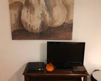 Kitchen TV on wood console, large painting above