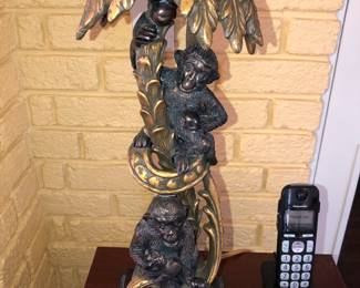 One of a pair of plastic monkey lamps