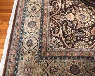 Fine hand knotted Persian or Turkish rug in living room 8’ x 10’