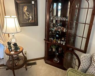 Corner curio cabinet, small two-tiered table, oil painting, lamps