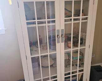 Crate and Barrol cabinet with window pane doors. Great quality and useful in any room of the house.