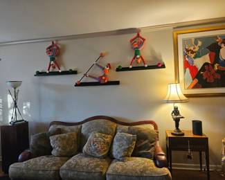 One of 2 couches. Whimisical wall decor.