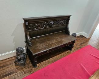 Heavily carved antique bench, heavy carved stone lions 
