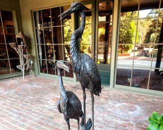 Bronze herons, water feature