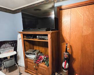TV Armoire 
Samsung flat screen TV
Duo VHS DVD player
VHS Player