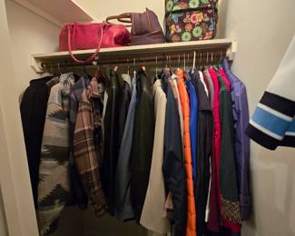 closets are full of nice clothes, luggage, purses, bags and more