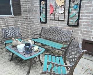 4-piece metal patio set.  Includes: 2 chairs, 3-seat bench and table. Colorful exterior wall art