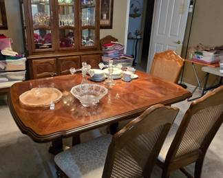 Gorgeous dining table with 2 leaves, 6 chairs and lighted China cabinet
