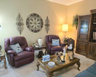set of matching Burgandy / maroon recliners, glass top coffee table, assorted end tables/occasional tables, child's wooden rocker, lamps and other home decor.  