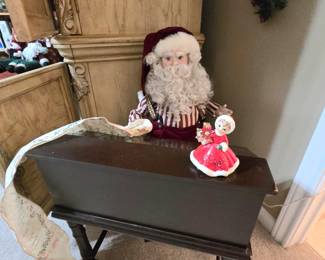 animated Santa at his desk with the "good" list