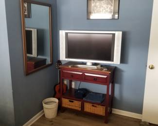 Storage table with baskets; TV
