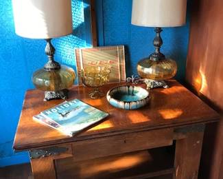 Lovely 1-drawer oak desk with iron strapping. Pair of tall amber glass lamps. (Base globe lights)