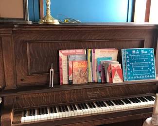 Antique Oak Upright Piano and stool. 