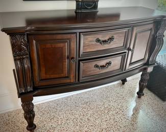 Dark wood sideboard with two cupboards and velvet-lined drawers