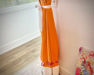Oversized orange, pink, and white room divider drapes