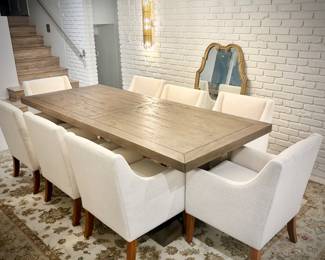 Wood trestle dining table and 8 ivory armchairs