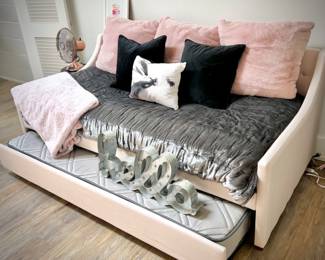 Daybed with trundle and pink/gray linens
