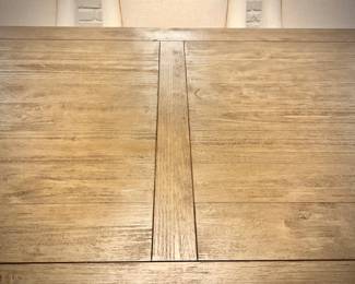 Wood trestle dining table and 8 ivory armchairs