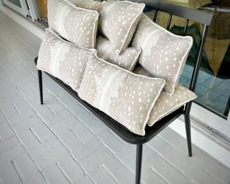 One of two metal outdoor benches