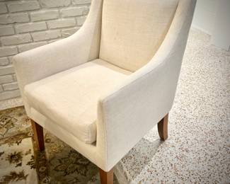 Wood trestle dining table and 8 ivory armchairs