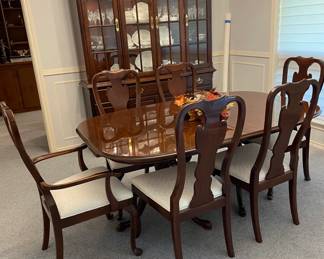 Drexel Dining Set and Hutch. Lighted Hutch is 90" h x 64" w x 15" deep. 3 drawers. 3 storage shelves. Immaculate. Needs one light bulb.