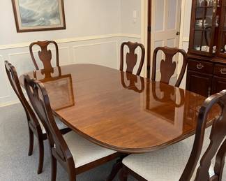 Drexel Dining Table and Chairs. Table is 68" long with 2 - 20" leaves. Another Captain chair is available. Immaculate condition.