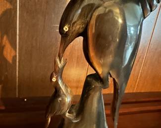 Hand carved horn figurines, bird feeding young