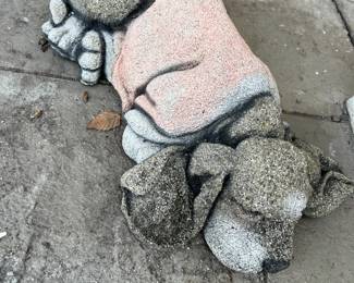 Concrete sleeping dog statue
