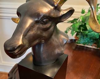 Hollywood Regency style two-tone brass ram head sculpture on wood base