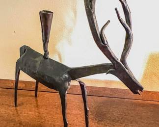 Primitive metal reindeer candle holder