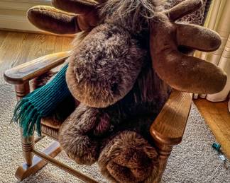 Rattan rocking chair with stuffed moose