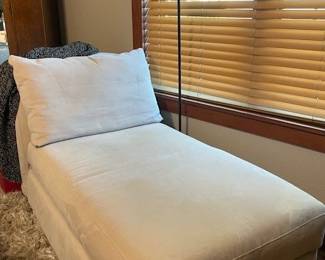 off white lounger and copper floor lamp