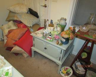 painted end table and assorted throw pillows