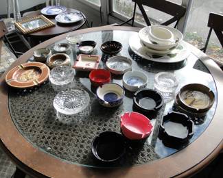 Vintage ashtrays in an assortment of decorative types and plain ones too