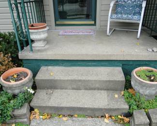 We do have quite a number of cement planters, in the front of the house, side of the house and the backyard too.  Sorry, but the cement steps are not for sale