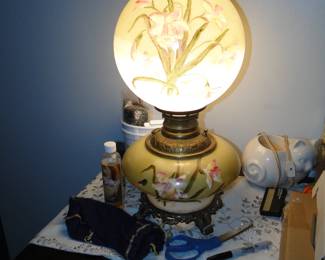 Double globe, lighted lamp, both globes glow, and hand painted as well
