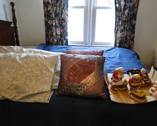 Pillows and the bed are all for sale too, even the praying Santa's