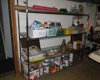 Bottom shelf of this unit with all the paints and painting supplies, and stains, and such and all the stuff for painting and staining are free of charge.  Zero.  The big goose egg.  Nada!!