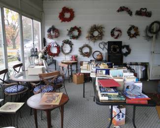 Welcome to the interior where you will find wreaths, and much much more, just in the Sunroom alone