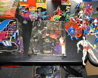 Spiderman and more to the right, and Batman to the left and middle