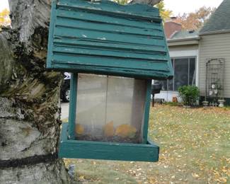 Plain green bird house, more to come, that are not plain, and that are not green