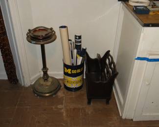 University of Michigan trash can filled with posters, and antique brass ashtray