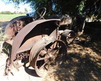 1927/28 Farmall. All parts appear to be present and ready for restoration.